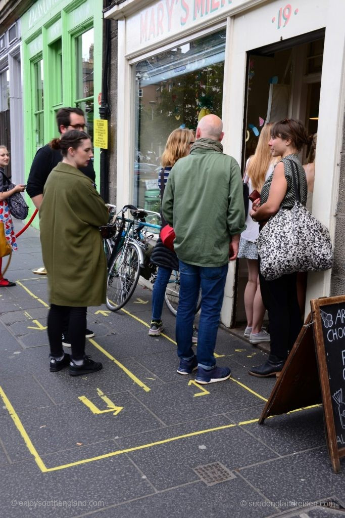 The British are well known to be world champions in disciplined queuing. This shop in Edinburgh seems to get larger crowds and has simply painted waiting lines on the pavement!