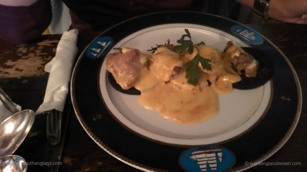 Pork medallions on black pudding and a creamy sauce with rosemary etc. as well as vegetables and new potatoes (these came separately)