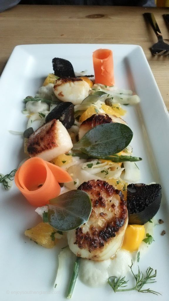 Scallops with black pudding and elaborate dressing